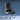 Black office chair with chrome accents on a blue background