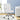 White office chair in a room with a desk and plant