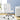 White office chair in a room with a desk and plant