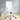 White office chair with chrome accents in a room with light-colored walls and wooden floor.