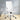 White office chair with chrome accents in a room with light-colored walls and wooden floor.