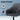 Gray chair with quality PU leather features on a blue background