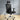 Black office chair with mesh backrest in a room with wooden floor and white walls