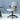 Gray office chair with mesh backrest in a minimalistic room.