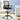 Black office chair in a room with a desk and plant