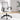 Grey office chair with black mesh backrest and armrests in a room with light-colored walls and wooden floor.