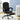 Black office chair with ottoman in a room with a desk and plants.