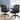 Two black office chairs in an office setting with a cityscape view.