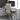 Beige office chair in front of a computer desk with a monitor.