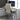 Beige office chair in front of a computer desk with a monitor.