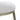 Close-up of a stool with a white cushioned seat and gold metal legs on a white background