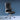 Black office chair with chrome accents on a blue background