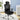 Black office chair with headrest in a room with a desk and plant